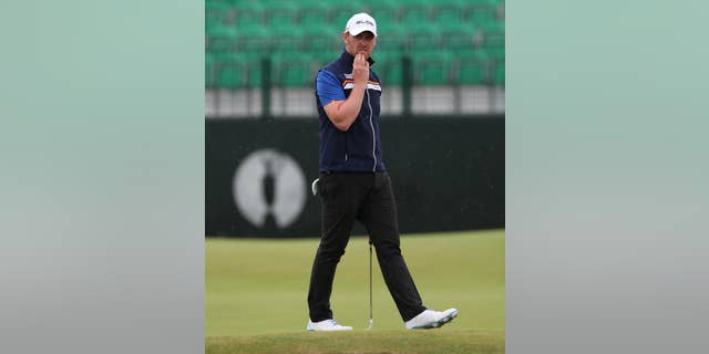 John Singleton of England looks at his ball on the 3rd green during a practice round ahead of the British Open Golf championship at the Royal Liverpool golf club, Hoylake, England, Wednesday July 16, 2014. The British Open Golf championship starts Thursday July 17. (AP Photo/Jon Super)