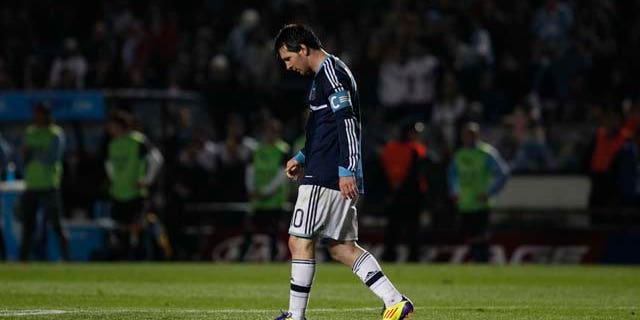 Argentina's Lionel Messi walks on the field during a Copa America quarterfinal soccer match against Uruguay in Santa Fe, Argentina, Saturday, July 16, 2011. Uruguay advanced to the Copa America semifinals with a 5-4 victory over Argentina on penalties after a 1-1 draw. (AP Photo/Dolores Ochoa)