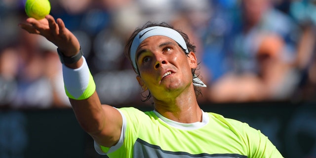 Rafael Nadal, of Spain, serves to Milos Raonic, of Canada, during their match at the BNP Paribas Open tennis tournament, Friday, March 20, 2015 in Indian Wells, Calif. (AP Photo/Mark J. Terrill)