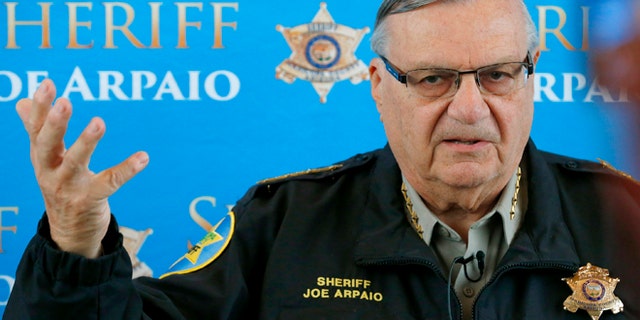 FILE - In this Dec. 18, 2013 file photo, Maricopa County Sheriff Joe Arpaio announces dozens of arrests in a prostitution sting during a news conference at Maricopa County Sheriff's Office Headquarters, in Phoenix. Arpaio and his top aide Chief Deputy Jerry Sheridan are required to appear before a federal judge who believes the two have mischaracterized and trivialized the judge's key findings in a racial-profiling decision issued in 2013 against the police agency. The sheriff's office will be required to provide answers Monday, March 24, 2014 to U.S. District Judge Murray Snow about an Oct. 18 training session in which the judge said Sheridan appears to suggest that rank-and-file deputies weren't obliged to make their best efforts to remedy the agency's constitutional violations. (AP Photo/Ross D. Franklin, File)