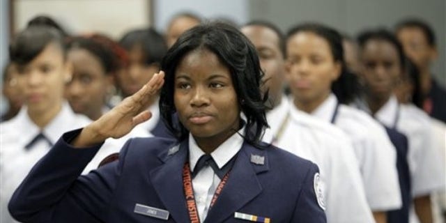 Nov. 12, 2009: Baltimore Polytechnic Institute Air Force Junior ROTC cadet Kwameka Jones salutes before her squad practiced drills.