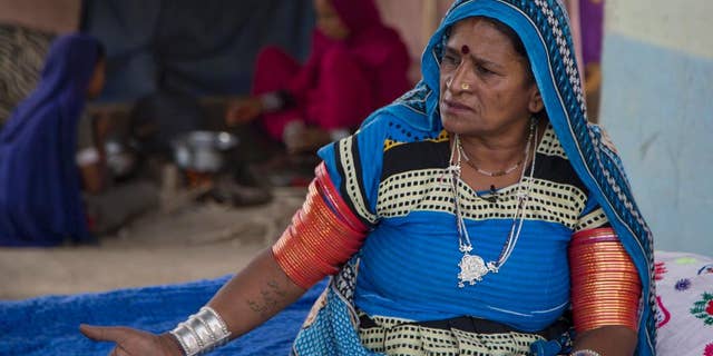 In this photo taken on Saturday , Dec. 3, 2016. Pakistani activist Veero Kohli talks to The Associated Press in Hyderabad, Pakistan. Kolhi, who also was a slave, fled bondage in 1999 walking for three days to safety, searching out the Human Rights Commission of Pakistan to help her before returning to the landowner to recover her children and free another eight of families. Since getting her freedom, Kolhi has devoted herself to challenging Pakistan's powerful landowners freeing thousands of families from bonded labor. (AP Photo/B.K. Bangash)