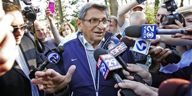 Nov. 8: Penn State football coach Joe Paterno speaks briefly to reporters as he leaves for football practice in State College, Pa. Paterno was later fired by the university board of trustees for not doing more to report allegations of child sex abuse by his former defensive coordinator Jerry Sandusky, who retired in 1999.