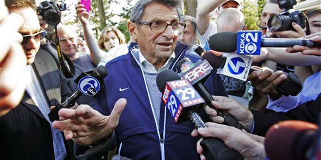 Nov. 8: Penn State football coach Joe Paterno speaks briefly to reporters as he leaves for football practice in State College, Pa. Paterno was later fired by the university board of trustees for not doing more to report allegations of child sex abuse by his former defensive coordinator Jerry Sandusky, who retired in 1999.
