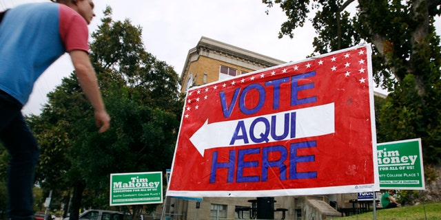 AUSTIN, TX - NOVEMBER 4: A sign shows the way to the polling station at Austin Community College on November 4, 2014 in Austin, Texas. Voters headed to the polls today to decide a number of tight races. (Photo by Erich Schlegel/Getty Images)