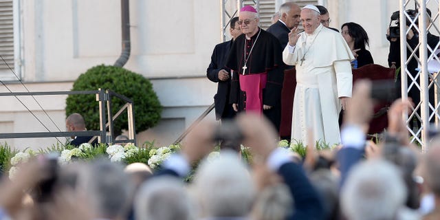 Pope Francis Pope Francis waves during as he meets with workers and businessmen during his visit to Turin, northern Italy, Sunday, June 21, 2015. Pope Francis earlier prayed in front of the Holy Shroud, the 14 foot-long linen revered by some as the burial cloth of Jesus, on display at the Cathedral of Turin. (AP Photo/Massimo Pinca)