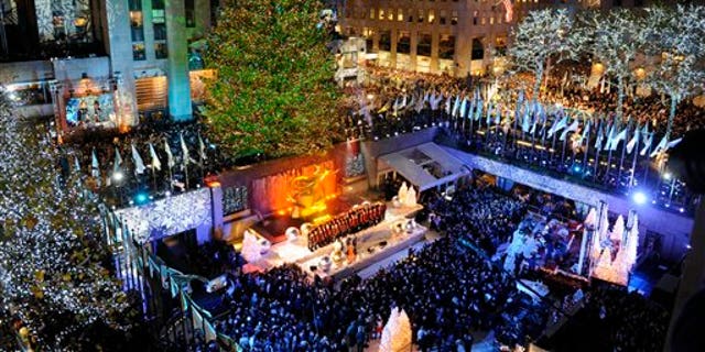 New York City The 74-foot-tall Rockefeller Center Christmas Tree is lit by 30,000 energy efficient LED lights in the 79th annual lighting ceremony, Nov. 30, 2011 in New York.&amp;#160;