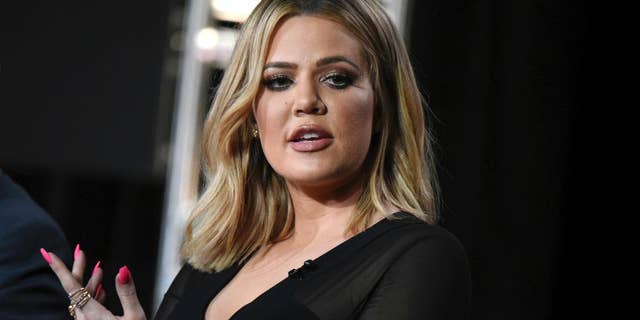 FILE - In this Jan. 6, 2016, file photo, Khloe Kardashian participates in the panel for "Kocktails with Khloe" at the FYI 2016 Winter TCA in Pasadena, Calif. Kardashian said on the "Ellen DeGeneres Show" in an interview broadcast on Tue., Oct. 11, 2016, that her older sister, Kim Kardashian West, is "not doing that well" more than a week after being held up during a Paris jewelry heist. (Photo by Richard Shotwell/Invision/AP, File)