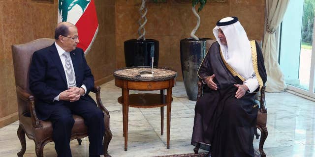 In this photo released by Lebanon's official government photographer Dalati Nohra, Lebanese President Michel Aoun, left, meets with Saudi Arabia's Prince Khaled al-Faisal, at the Presidential Palace in Baabda, east of Beirut, Lebanon, Monday, Nov. 21, 2016. al-Faisal said, he handed an invitation to the newly elected Lebanese president to visit the oil-rich kingdom. (Dalati Nohra via AP)