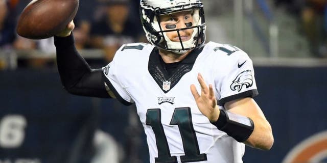 Sep 19, 2016; Chicago, IL, USA; Philadelphia Eagles quarterback Carson Wentz (11) drops back to pass against the Chicago Bears during the second quarter at Soldier Field. Mandatory Credit: Mike DiNovo-USA TODAY Sports