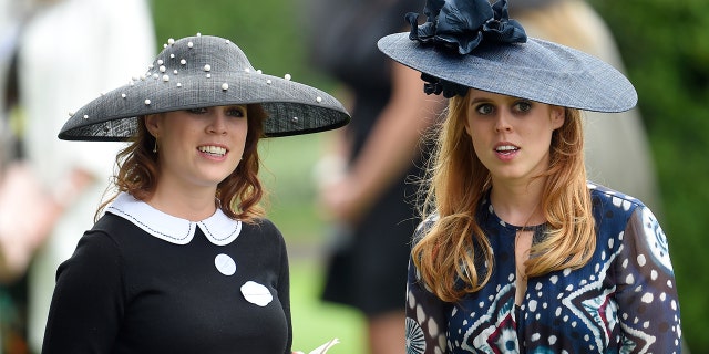 Britain's Princess Eugenie (L) and Princess Beatrice at Ascot.