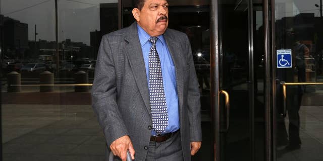 FILE - In this Aug. 22, 2013 file photo, former El Salvadoran military Col. Inocente Orlando Montano departs federal court, in Boston. More than a year after a his extradition was ordered, the former Salvadoran colonel remains far from answering charges of plotting the 1989 deaths of six Jesuit priests as an American judge considers legal entanglements still reverberating long after the country’s civil war. Now the failing health of 75-year-old Inocente Orlando Montano Morales raises the question of whether he will live long enough to face trial in Spain or El Salvador. (AP Photo/Steven Senne, File)
