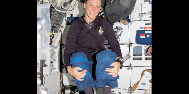 Astronaut Lisa M. Nowak, STS-121 mission specialist, floats on the middeck of the space shuttle Discovery while docked with the international space station, July 8, 2006. Nowak, 43, a married mother of three, was charged Tuesday, Feb. 6, 2007 with attempted murder, accused of hatching an extraordinary plot to kidnap Colleen Shipman, who she believed was romantically involved with another shuttle astronaut, William Oefelein. (AP Photo/NASA)