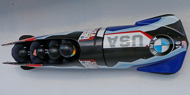 In this Nov. 18, 2017, file photo, pilot Codie Bascue, front, Nathan Weber, Carlo Valdes and Samuel McGuffie, of the United States, compete in the four-man bobsled World Cup race in Park City, Utah.