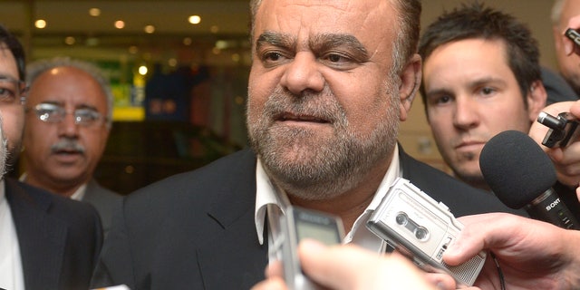 Iran's Minister of Petroleum Rostam Ghasemi talks to journalists as he arrives at a hotel for the Organization of the Petroleum Exporting Countries, OPEC, conference in Vienna, Austria, Thursday, May 30, 2012. Once the symbol of oil dominance, OPEC faces new challenges as its members gather for a ministerial meeting on how much crude to pump. For the 12 oil ministers from countries ranging from Venezuela to Nigeria and Iran, the formal focus of Friday's get-together is to determine production levels. (AP Photo/Hans Punz)