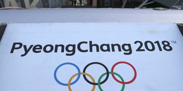 The Olympic rings with a sign of 2018 Pyeongchang Games is seen at the Imjingak Pavilion in Paju, South Korea, Friday, Jan. 19, 2018.