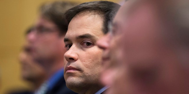Sen. Marco Rubio, R-Fla., looks out from his seat before speaking at Catholic University of America, in Washington, Wednesday, July 23, 2014. Trying to win forgiveness for pushing a failed immigration overhaul, Rubio is rushing to woo social conservatives ahead of a potential 2016 White House run. While Rubio has consistently held conservative positions on abortion and gay marriage, his emphasis now is an effort to find support among social conservatives who have yet to settle on a favored candidate in the presidential campaign that is in its nascent stages.  (AP Photo)