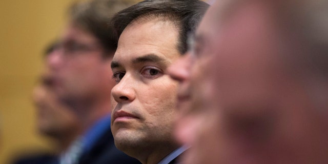 Sen. Marco Rubio, R-Fla., looks out from his seat before speaking at Catholic University of America, in Washington, Wednesday, July 23, 2014. Trying to win forgiveness for pushing a failed immigration overhaul, Rubio is rushing to woo social conservatives ahead of a potential 2016 White House run. While Rubio has consistently held conservative positions on abortion and gay marriage, his emphasis now is an effort to find support among social conservatives who have yet to settle on a favored candidate in the presidential campaign that is in its nascent stages. (AP Photo)