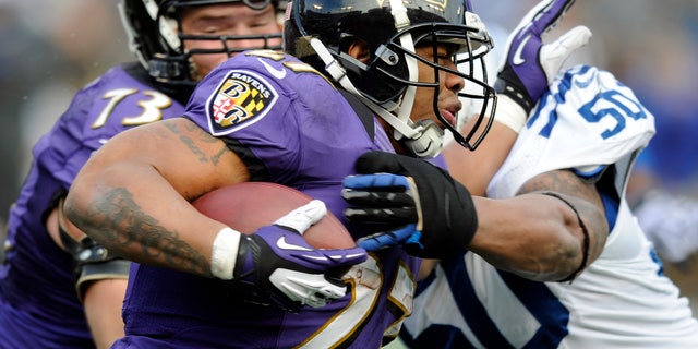 Jan. 6, 2013: Baltimore Ravens running back Ray Rice (27) is hit by Indianapolis Colts inside linebacker Jerrell Freeman (50) during the first half of an NFL wild card playoff football game in Baltimore. (AP/Nick Wass)