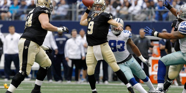 New Orleans Saints quarterback Drew Brees, #9, passes the ball during the first half of an NFL football game on Sunday, December 23, 2012, in Arlington, Texas, against the Dallas Cowboys.