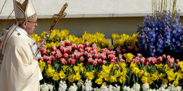 Pope Francis is shown celebrating the Easter Mass in St. Peter's Square, at the Vatican, on Sun., April 16, 2017. (AP Photo/Andrew Medichini)