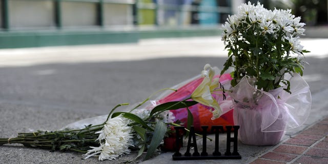LOS ANGELES, CA - FEBRUARY 28: Flowers are placed in front of the building at the 900 block of South Flower Street where Marie Osmonds son Michael Blosil committed suicide on February 28, 2010 in Los Angeles, California. (Photo by Toby Canham/Getty Images)