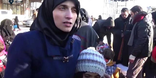 This image made from video released by Qasioun News Agency, a media opposition platform with reporters inside Syria, shows Fatemah Alabed, with her 7-year-old daughter Bana, speaking after they reached the Aleppo countryside following the evacuation of their city, Syria.