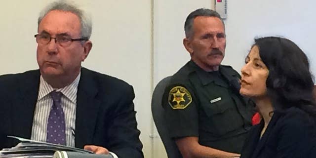 Norma Patricia Esparza sits during her sentencing hearing with her attorney, Jack Earley on Friday, July 15, 2016, in Santa Ana, Calif. Esparza a former psychology professor was sentenced Friday to six years in prison for the 1995 killing of a man she says raped her while she was a Southern California college student. Esparza, pleaded guilty in 2014 to voluntary manslaughter in exchange for the sentence in the death of Gonzalo Ramirez. She did not speak as she was sentenced with two co-defendants. (AP Photo/Amy Taxin)