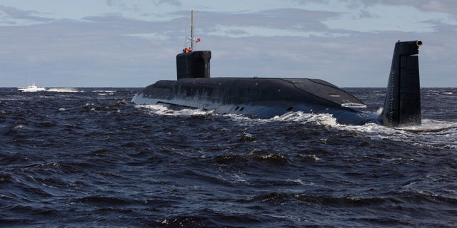 A Russian nuclear submarine, the Yuri Dolgoruky, is seen undergoing sea trials near Arkhangelsk, Russia.  The submarine was commissioned by the Russian Navy on Thursday, Jan. 10, 2013. (AP Photo/Alexander Zemlianichenko, pool, file)
