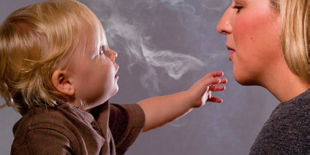 This handout image, released on November 10, 2010 depicts a mother blowing cigarette smoke in a child's face in one of the Federal Drug Administration's proposed new "graphic health warnings." Diseased lungs, dead bodies, a man on a ventilator and mothers blowing smoke in their children's faces are among the images unveiled on Wednesday that U.S. health officials are considering in their effort to revamp tobacco warning labels. REUTERS/HHS/Handout (UNITED STATES - Tags: BUSINESS POLITICS HEALTH) FOR EDITORIAL USE ONLY. NOT FOR SALE FOR MARKETING OR ADVERTISING CAMPAIGNS. THIS IMAGE HAS BEEN SUPPLIED BY A THIRD PARTY. IT IS DISTRIBUTED, EXACTLY AS RECEIVED BY REUTERS, AS A SERVICE TO CLIENTS