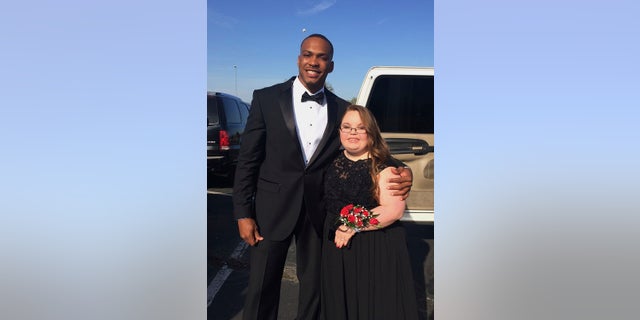 Don Jones and Lindsey Preston pose for a prom photo on April 13.
