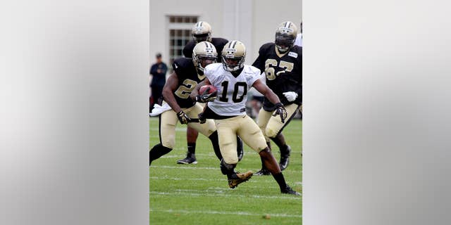 New Orleans Saints wide receiver Brandin Cooks (10) runs the ball during their NFL football training camp in White Sulphur Springs, W.Va., Saturday, Aug. 2, 2014. (AP Photo/Chris Tilley)