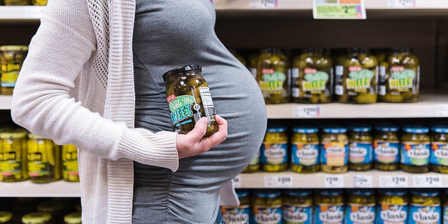 The mom-to-be shopped for pickles, kettle corn, ice cream and TUMS.