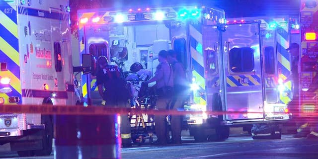 In this photo provided by KARE, a person is brought into an emergency vehicle after a shooting early Monday, Oct. 3, 2016, in Minneapolis. Minneapolis police said multiple people have been wounded in shootings in downtown Minneapolis. (KARE via AP)