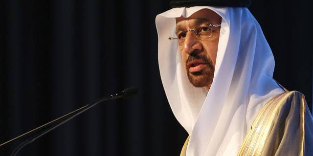 FILE- In this Jan. 12, 2017 file photo, Saudi's Oil Minister Khalid al-Falih, speaks during an Energy Forum in Abu Dhabi, United Arab Emirates. On Thursday, April 20, 2017, Al-Falih suggested that production cuts agreed to by OPEC members and countries outside of the cartel may need to continue to help shore up crude oil prices. (AP Photo/Kamran Jebreili, File)