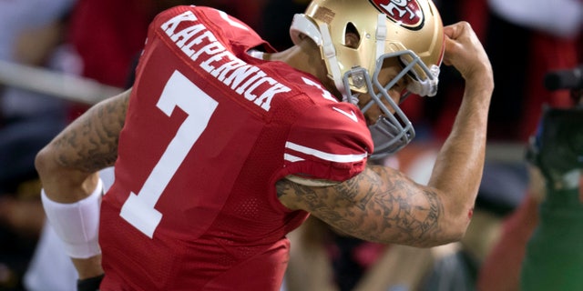 San Francisco 49ers quarterback Colin Kaepernick (7) celebrates his touchdown against the Green Bay Packers during an NFC divisional playoff NFL football game on Saturday, Jan. 12, 2013, in San Francisco. (AP Photo/The Sacramento Bee, Hector Amezcua)