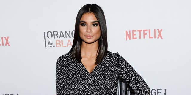 FILE- IN this June 11, 2015, file photo, actress Diane Guerrero attends Netflix's "Orange is the New Black" ORANGECON Celebration at Skylight Clarkson SQ in New York. The depression, the anxiety and the emotional instability that Guerrero went through due to the separation from her parents are some of the points she writes about in her new memoir "In the Country We Love: My Family Divided," as well as her later professional development and her work in the successful Netflix series "Orange Is The New Black" and The CW’s "Jane The Virgin." (Photo by Evan Agostini/Invision/AP)