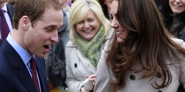 In this Tuesday, March 8, 2011 file photo, Britain's Prince William and Kate Middleton prepare to flip pancake at a display by the charity Northern Ireland Cancer Fund for Children outside the City Hall in Belfast, Northern Ireland.