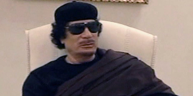 May 11: In this image made from Libyan TV, Libyan leader Muammar al-Qaddafi holds a meeting with tribal leaders from eastern Libya.