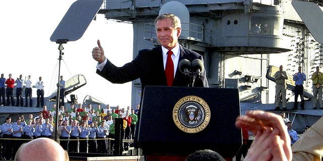 Former President George W. Bush declares the end of major combat operations in Iraq aboard aircraft carrier USS Abraham Lincoln. The war appeared at the time to be a success, but later, as conditions in Iraq deteriorated, the message of "mission accomplished" was criticized as premature.