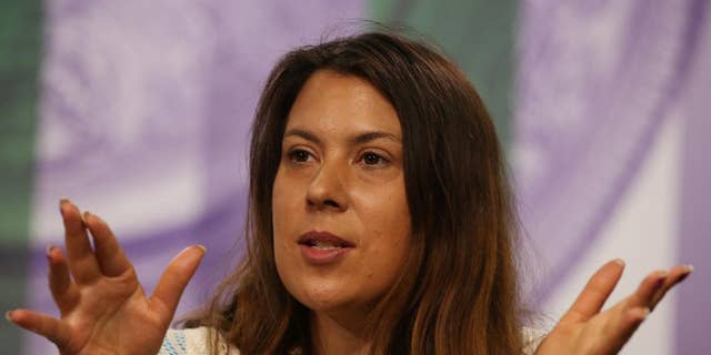 2013 Wimbledon champion Marion Bartoli of France attends a press conference at the All England Lawn Tennis Championships in Wimbledon, London,  Sunday June 22, 2014.  The Championships start Monday June 23. (AP Photo/AELTC, Scott Heavey)