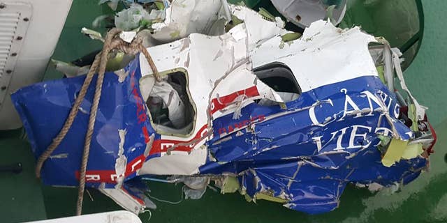 The wreckage of a maritime patrol aircraft that went missing is seen on a maritime police vessel off the coast of northern port city of Hai Phong, Vietnam, Friday, June 17, 2016. Vietnamese rescuers have found some pieces belonging to a search plane that went missing with nine people aboard while attempting to locate a pilot from a crashed fighter jet, the military said Friday. (Hong Pha/Vietnam News Agency via AP)