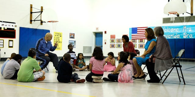 SILVER SPRING, MD - MAY 19: U.S. first lady Michelle Obama (3rd R) and her Mexican counterpart Margarita Zavala (2nd R) listen to PE teacher Thomas Ryan (L) during a physical education class as they visit New Hampshire Estates Elementary School, which was awarded the USDA?s Healthier US School Challenge Silver Award in 2009 and partnered with a school in Mexico as part of the Monarch Butterfly Sister School Program, May 19, 2010 in Silver Spring, Maryland. President of Mexico Felipe Calderon is on a state visit to Washington with the first lady of Mexico. (Photo by Alex Wong/Getty Images)