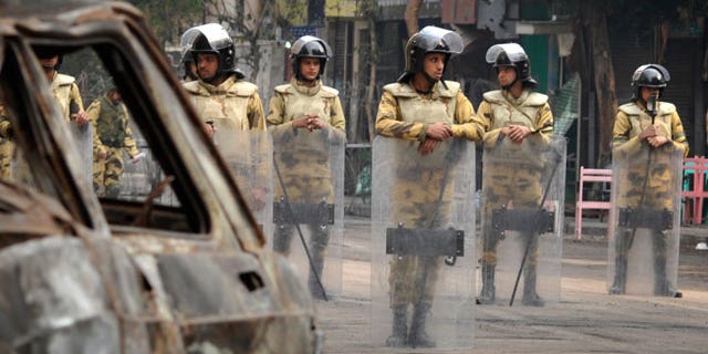 Nov.26, 2011:gyptian soldiers stand guard on the street leading from Tahrir Square to the Interior Ministry in Cairo, Egypt.