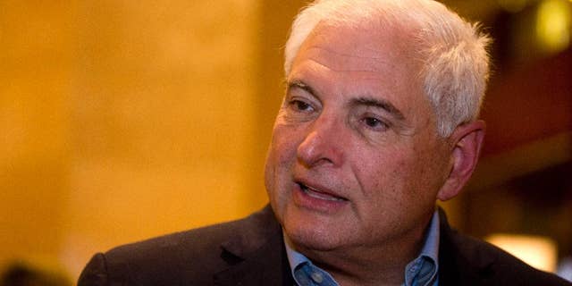 FILE - In this Jan. 28, 2015, file photo, Panama's former President Ricardo Martinelli answers questions during an interview at a hotel in Guatemala City. A judge said Friday, Dec. 11, 2015, that Martinelli is in contempt of court for failing to appear at a session in which he was expected to be charged with illegally spying on opponents. (AP Photo/Moises Castillo, File)