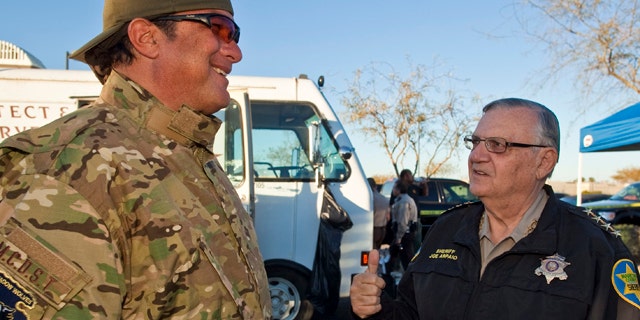 Maricopa County Sheriff Joe Arpaio, right, talks with actor Steven Seagal, who was visiting the sheriff.