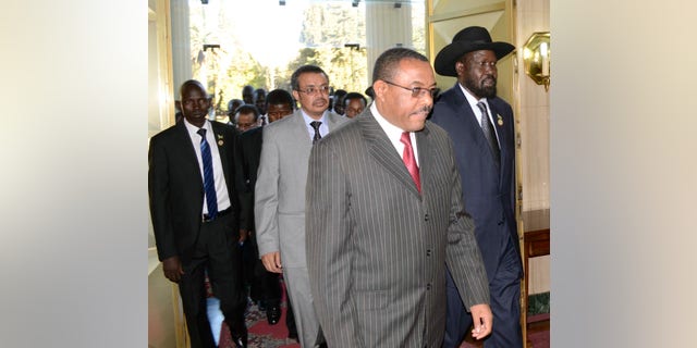 President Salva Kiir, right, of South Sudan arrives at the National Palace with Prime Minister Hailemariam Dessalegn, left, of Ethiopia during talks in Addis Ababa, Ethiopia, Friday Jan. 4, 2013.The presidents of Sudan and South Sudan are meeting to try to break through stalled oil agreements.(AP Photo)