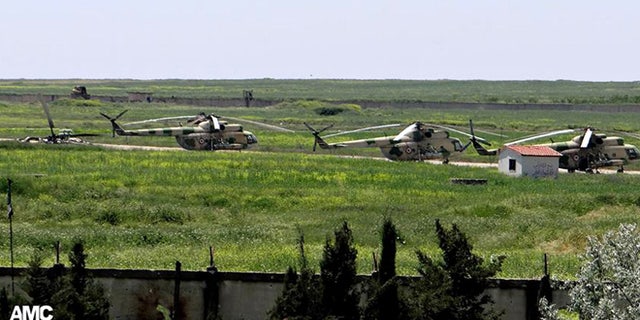 June 18, 2013: In this file photo, citizen journalism image provided by Aleppo Media Center AMC which has been authenticated based on its contents and other AP reporting, shows Syrian military helicopters at Mannagh air base in Aleppo province, Syria.