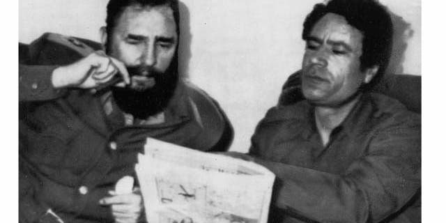 FILE - In this March 8, 1977 file photo Cuban leader Fidel Castro and Moammar Gadhafi meet in Tripoli, Libya. As rebels swarmed into Tripoli late Sunday, Aug. 21, 2011, and Gadhafi's son and one-time heir apparent Seif al-Islam was arrested, Gadhafi's rule was all but over, even though some loyalists continued to resist. (AP Photo, File)