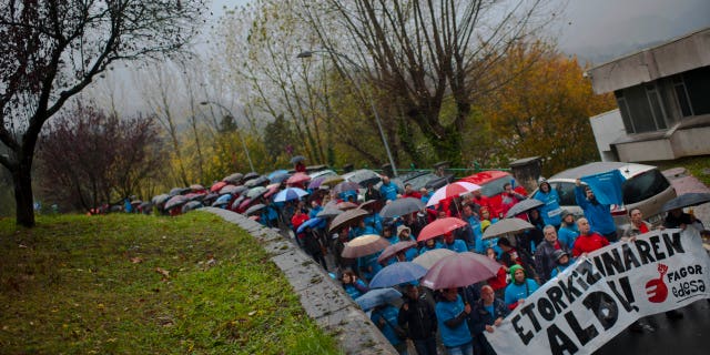 Employees of the Spanish appliance maker Fagor-Edesa Electrodomesticos protest in defense of their jobs, in Arrasate Mondragon, northern Spain, Monday Nov. 11, 2013. Fagor-Edesa, which claims to be Europe's fifth-largest appliance maker and has nearly 6,000 employees, has filed for bankruptcy protection after years of economic crisis caused a dramatic drop in sales. The company, part of the Basque region's Mondragon cooperative, has said it was unable to find financing to pay off an unspecified amount of debt. Banner reads:, "For Our Future". (AP Photo/Alvaro Barrientos)